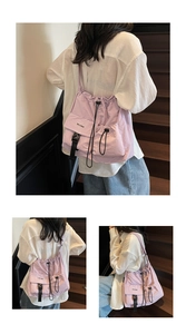 Detail view of the light purple waterproof nylon drawstring bag with a front buckle pocket