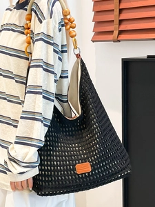 Handmade black crochet tote bag with wooden bead straps and inner lining for women