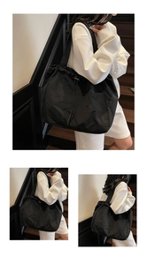 Three-way view of a black nylon drawstring tote bag worn by a model in casual style