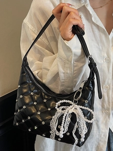 Quilted black leather crescent bag with silver rhinestones and pearl lace bow charm