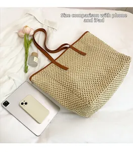 Detail of woven straw tote bag with brown handles showing size compared to an iPad
