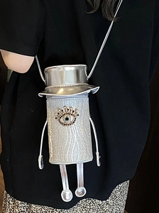 Futuristic silver mini crossbody bag in robot shape with sparkling glitter and rhinestones