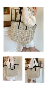 Detailed macro view of beige woven tote bag texture with black leather shoulder straps