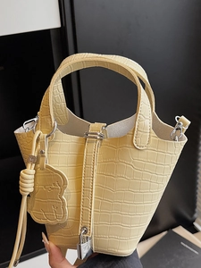 Fashionable light yellow crocodile pattern bucket bag with cute bear charm for women