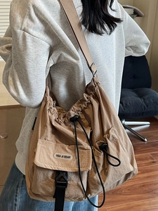 Minimalist khaki drawstring crossbody bag with large capacity for casual commuting use