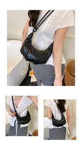 Detailed view of the vertical pleats and soft texture on this black hobo shoulder bag
