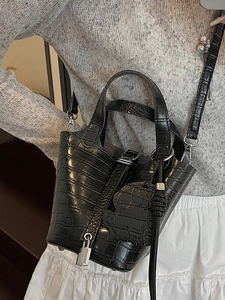 Elegant black crocodile pattern bucket bag with silver padlock and detachable shoulder strap