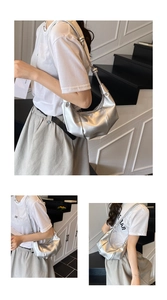Three-way view of a silver metallic pleated dumpling bag with stylish knotted shoulder strap