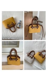 Detailed views of vintage shell handbags in yellow and cream with faux leather trim