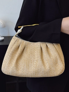 Exquisite woven straw handbag with golden metal handles for beach summer vacation style