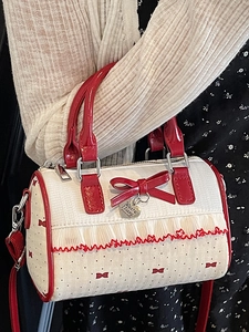 Sweet cream and red Boston bag with bow, lace trim, and crossbody strap for women