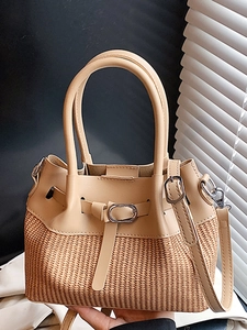 Straw patchwork bucket bag with beige leather trim and adjustable crossbody strap