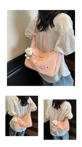 Pink crossbody bag with cat embroidery and plush charm shown from multiple angles