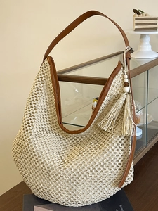 Beige woven mesh hobo bag with brown PU leather trim and decorative tassel detail