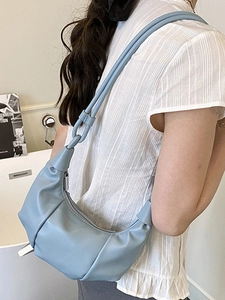 Chic light blue pleated dumpling bag with knotted strap for casual summer wear