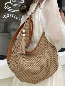 French style straw shoulder bag with brown leather trim and tassel for summer beach vacations