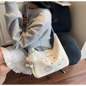 White shoulder bag featuring cute cat embroidery and soft plush cloud charm detail
