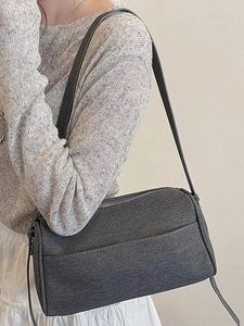 Minimalist dark gray denim shoulder bag for women with top zipper and adjustable strap