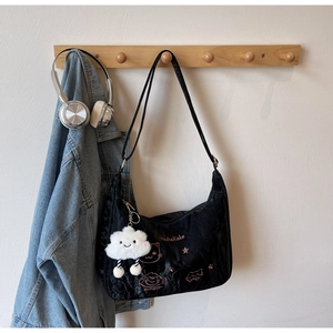 Black pleated velvet hobo bag with pink MashaKeke embroidery and white cloud pendant