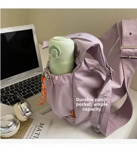 Detail of lavender nylon bag showing durable side pocket for water bottle storage