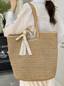 Bohemian handmade straw woven tote bag with lace bow and leather straps for beach holidays