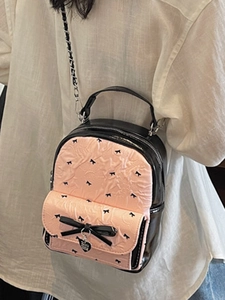 Pink and black seersucker mini backpack with bow print and heart charm for women
