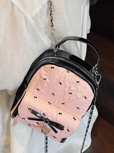 Pink and black seersucker mini backpack with bow print and silver heart pendant