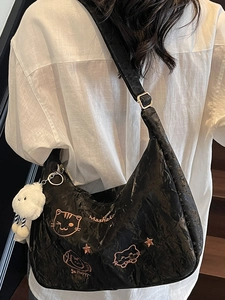 Cute black pleated shoulder bag with gold cat embroidery and fluffy cloud charm