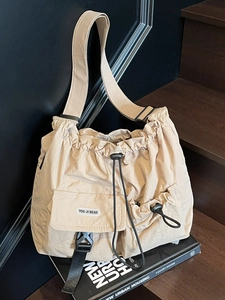Large capacity beige pleated nylon tote bag with drawstring and shoulder strap for daily use