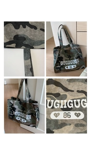 Detail shot of camo tote bag featuring white GUGIIGUGII logo and durable felt texture