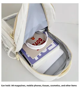 Detailed interior view of a spacious cream white school backpack with organized mesh pockets