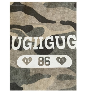 Close-up of camouflage tote bag fabric with white UGIIGUG letters and 86 print