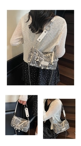 Detail of zebra pattern shoulder bag with pearl charms and silver chain strap