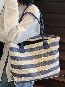 Blue and white striped woven tote bag for summer beach vacation and daily commute