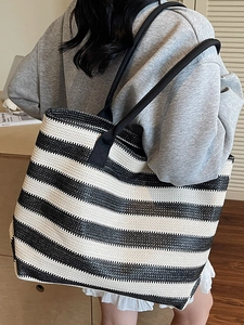 Large black and white striped woven tote bag for summer beach vacation and daily commuting