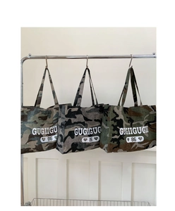 Detailed view of large camouflage tote bags with street style letter printing