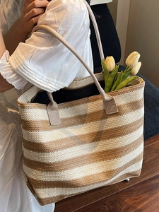 Large woven tote bag with brown and cream stripes and comfortable fabric shoulder straps