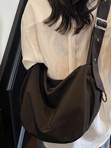 Black large capacity half-moon crossbody canvas bag with adjustable wide shoulder strap