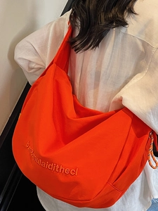 Bright orange canvas crossbody bag for women with minimalist embroidery and large capacity