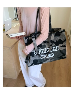 Detail of large camo tote bag showing high-quality canvas texture and printed logo