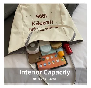 Detail showing high-capacity canvas tote bag interior with tablet and cosmetics