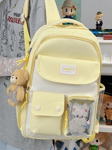 Minimalist Japanese-style student backpack in yellow and white with cute window and charms