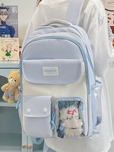Blue and white school backpack with clear window pocket and plush bear pendant