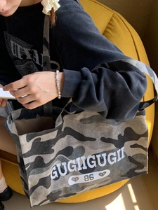 Large camouflage tote bag with letter print and wide handles for casual daily style
