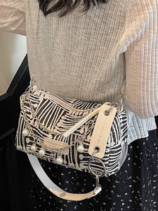 Fashionable black and white striped tote bag with pearl chain straps for women