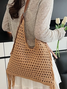 Handmade woven tassel tote bag in khaki with leather strap and hollow mesh pattern