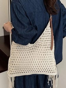 Handmade crochet fringe shoulder bag in cream white with adjustable brown leather strap