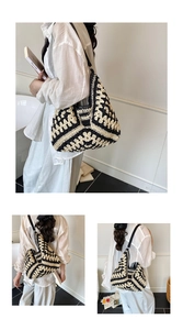 Detail view of large woven tote bag with black and white geometric crochet texture