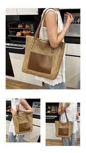 Detail view of large straw tote bag featuring a leather front pocket in a kitchen setting