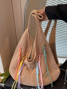 Boho hand-woven crochet tote bag with colorful tassels and beige open knit design